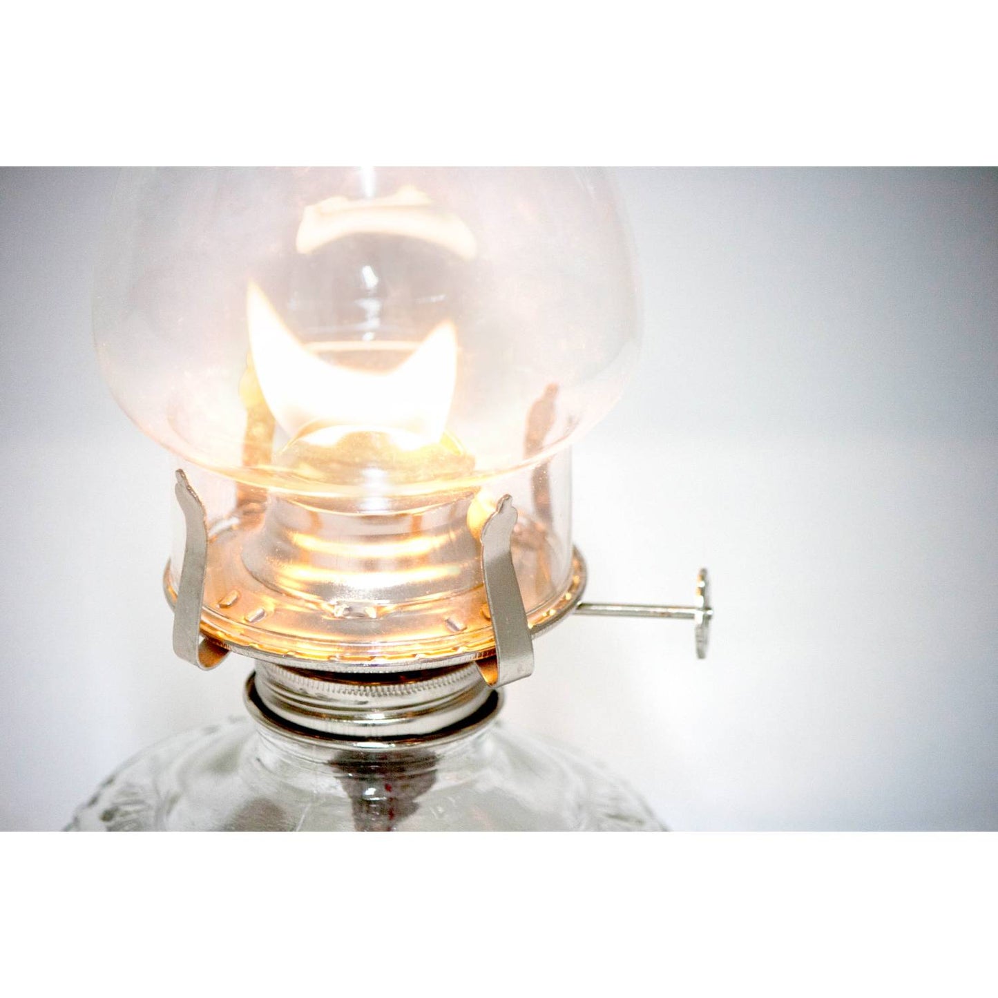 Close-up of a handcrafted oil lamp with a bright flame under a clear glass chimney, part of Farm, Garden & Tool, Lamps & Lighting, and Emergency Supplies collections.