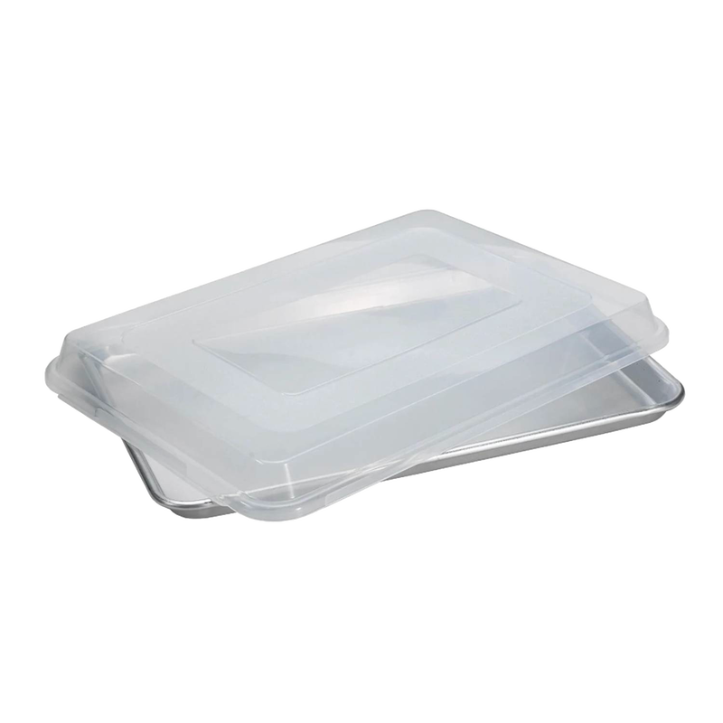 Aluminum half sheet pan with a clear plastic lid designed for even baking and easy transport, ideal for kitchen, baking supplies, and storage in USA-made cookware collections.