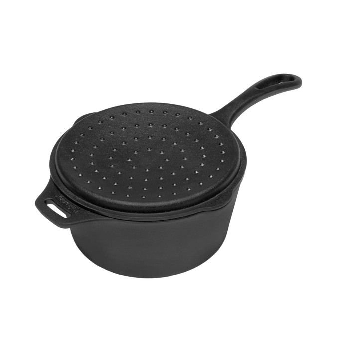 Black cast iron saucepan with a textured self-basting lid and long handle, designed for outdoor cooking and ideal for farm, garden, camping, cookware, and cast iron collections.