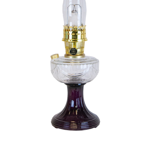 Handcrafted oil lamp featuring a clear glass font over a rich amethyst glass pedestal base with polished brass burner, ideal for Lamps & Lighting, Oil Lamps, Table Lamps, and Best Sellers collections.