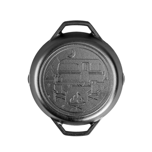 Handcrafted cast iron camper pan with dual handles, featuring a stamped campsite scene with camper, campfire, and trees, made in USA, perfect for camping and kitchen use.