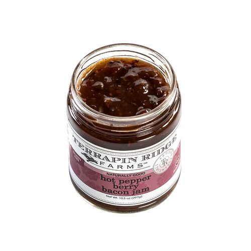 Open jar of handcrafted hot pepper bacon jam with visible textured blend, made in USA and featured in Kitchen & Food, Pantry, and Best Sellers collections.