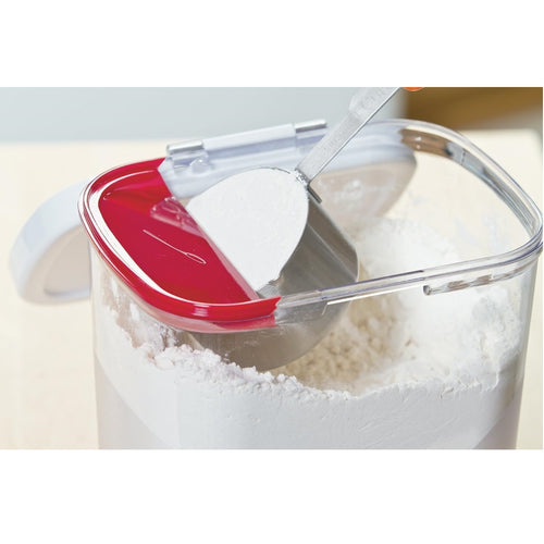 Clear plastic flour storage container with airtight white lid and built-in red measuring leveler, designed for precise portioning and freshness in Kitchen & Food, Storage and Serving collections.