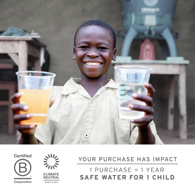 Smiling child holding two clear cups, one with cloudy water and the other with clear filtered water, illustrating clean drinking water impact for Farm, Garden & Tool and Emergency Supplies collections.