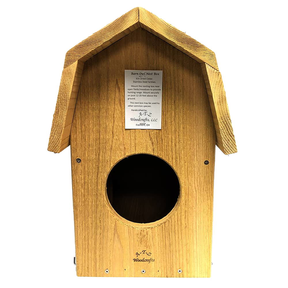 Handcrafted barn owl shelter made of unfinished kiln-dried cedar with a pitched roof and circular entrance, designed for outdoor use in Farm, Garden & Tool and Garden Accessories collections.