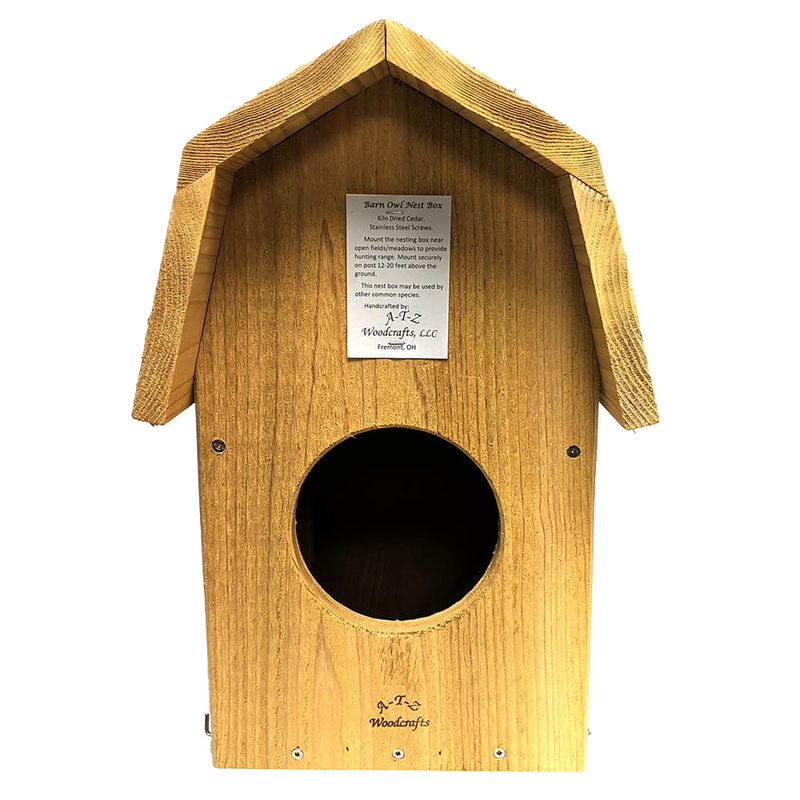 Handcrafted barn owl shelter made of unfinished kiln-dried cedar with a pitched roof and circular entrance, designed for outdoor use in Farm, Garden & Tool and Garden Accessories collections.