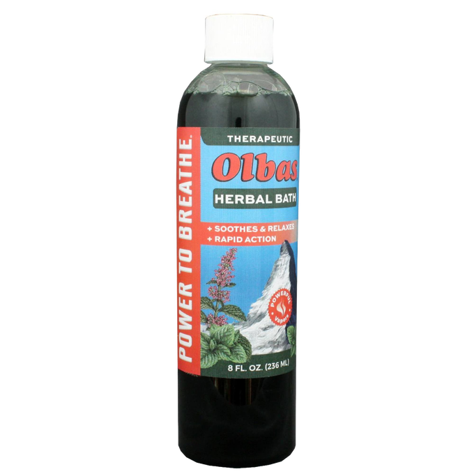 Tall plastic bottle of Olbas Herbal Bath liquid with a therapeutic label featuring natural herbs and a mountain scene, designed for Health & Wellness and personal hygiene collections.