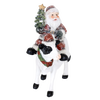 Handcrafted 6-inch resin figurine featuring Santa riding a festive cow adorned with a Christmas wreath and tree, perfect for Home & Decor, Holiday Decor, Best Sellers, and Promo Eligible collections.