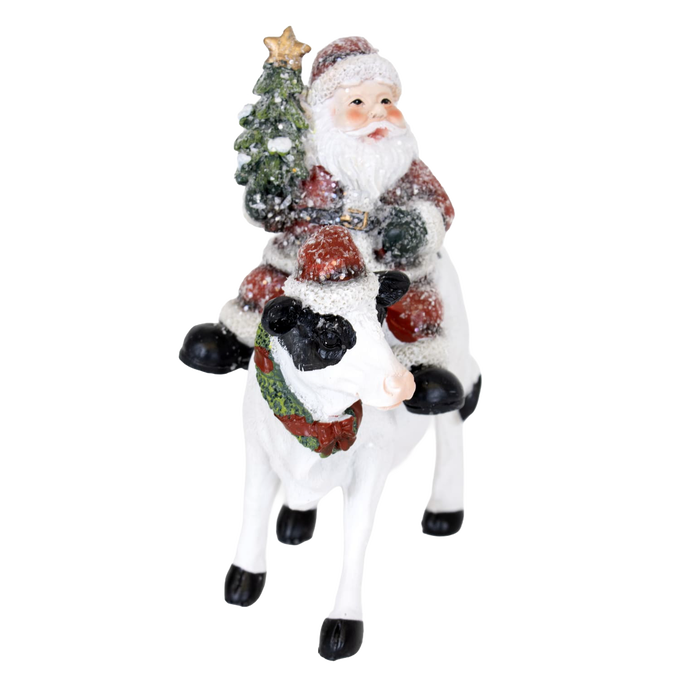 Handcrafted 6-inch resin figurine featuring Santa riding a festive cow adorned with a Christmas wreath and tree, perfect for Home & Decor, Holiday Decor, Best Sellers, and Promo Eligible collections.