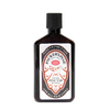 Dark amber bottle of handcrafted natural pine tar shampoo with white label featuring traditional design, highlighting scalp relief and invigoration, part of USA Made health collections.
