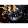 Cast iron smoker skillet emitting smoke on a grill with chicken wings cooking, showcasing durable cookware ideal for Kitchen & Food, Cast Iron, USA Made, and Best Sellers collections.