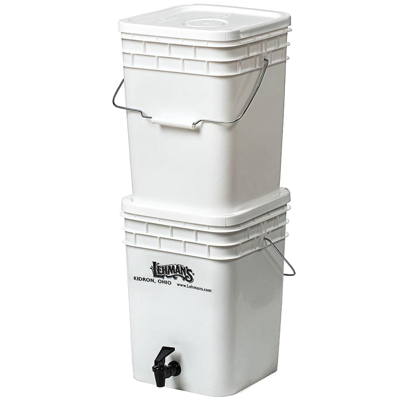 White two-bucket water filtration system with metal handles and a spigot on the lower bucket, designed for durable, portable water purification in farm, garden, emergency, and appliance use.