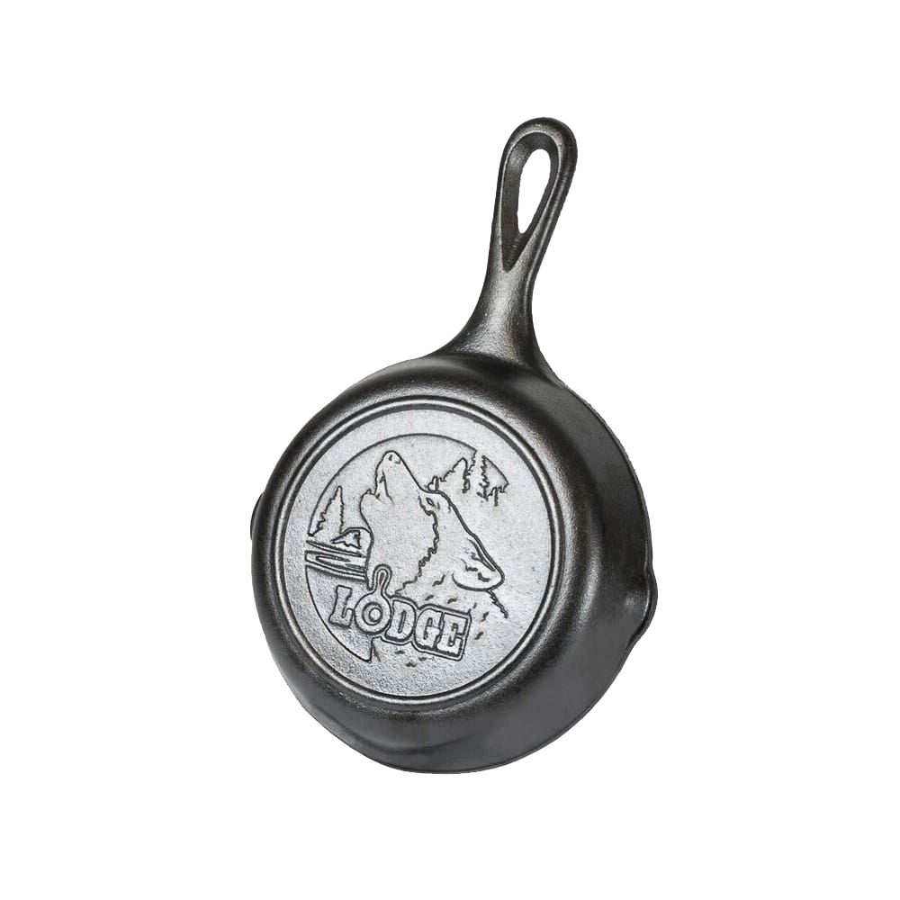 Small cast iron skillet with an embossed howling wolf and forest scene on the base, designed for Kitchen & Food, Cookware, Cast Iron, and USA Made collections.
