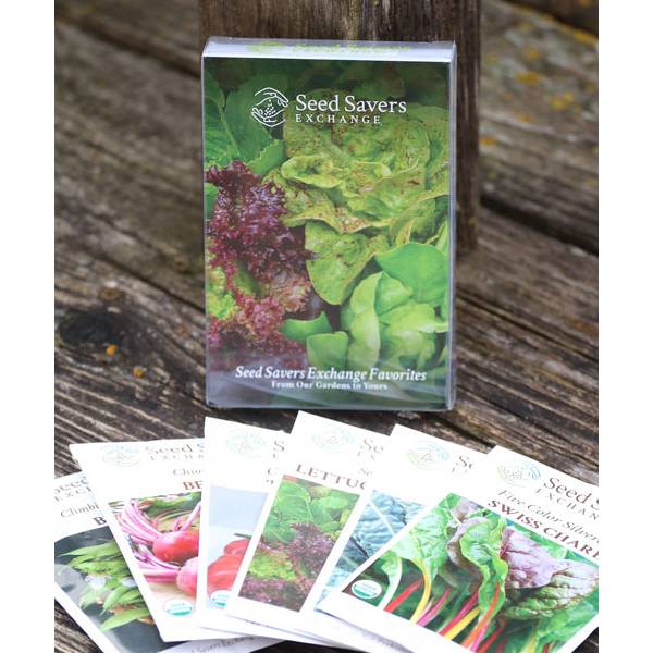 Set of six heirloom seed packets with colorful vegetable varieties displayed on a wooden surface, ideal for Farm, Garden & Tool, Seeds and Planting, USA Made, and Best Sellers collections.