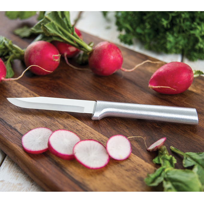 Rada paring knife with a sharp carbon stainless steel blade and durable cast aluminum handle featuring a non-slip satin finish, resting on a wooden board with sliced radishes, ideal for kitchen food prep in USA made and best sellers collections.