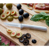 Sleek paring knife with a satin-finished cast aluminum handle and sharp carbon stainless steel blade resting on a wooden board with sliced olives, fresh basil, and pizza, ideal for kitchen and food prep in USA made collections.