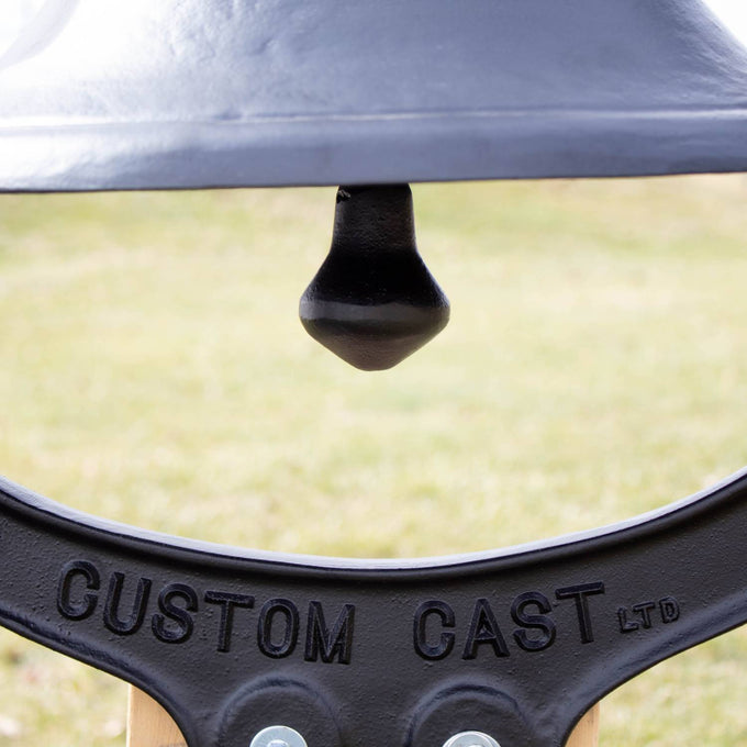 Close-up of the striker inside a black painted cast aluminum farm bell, handcrafted and Amish made, perfect for Home & Decor, Farm, Garden & Tool, and Amish Made collections.