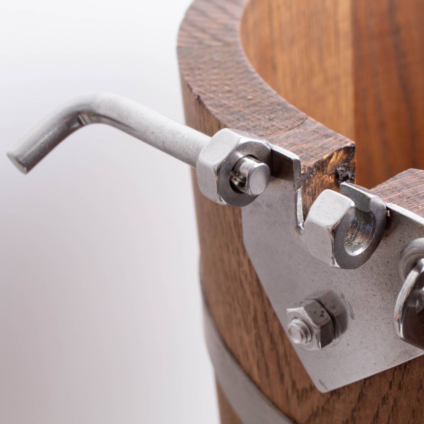 Close-up of the sturdy metal crank handle attached to a handcrafted wooden bucket of a Lehman's Best Ice Cream Freezer, showcasing rugged Amish made construction for Kitchen & Food and Specialty Equipment collections.
