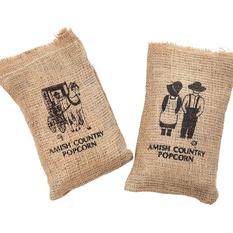 Two handcrafted burlap bags featuring silkscreened Amish Country designs, filled with popcorn, ideal for Kitchen & Food, Snacks and Sweets, USA Made, and Best Sellers collections.