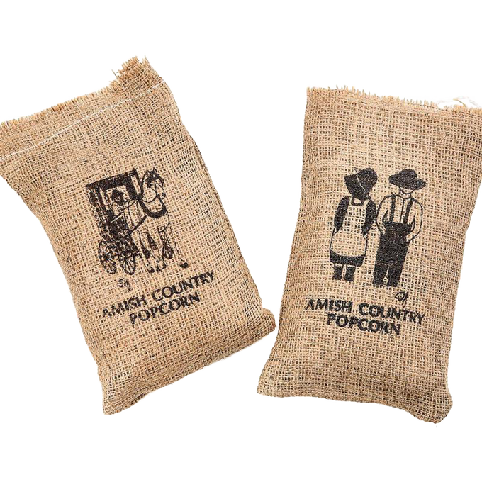 Two handcrafted burlap bags featuring silkscreened Amish Country designs, filled with popcorn, ideal for Kitchen & Food, Snacks and Sweets, USA Made, and Best Sellers collections.