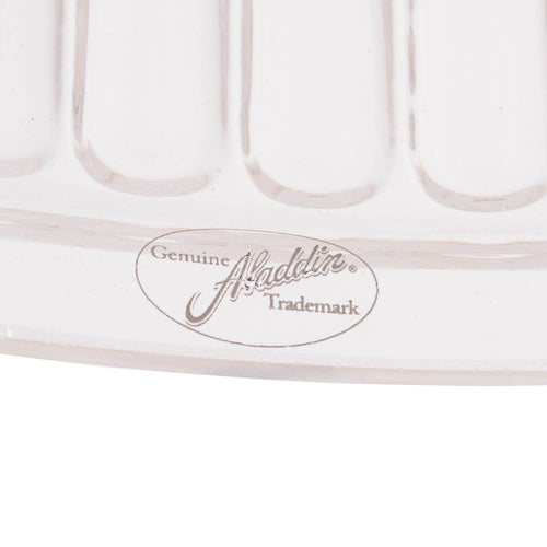 Close-up of a clear glass oil lamp shade edge with embossed Aladdin trademark, showcasing craftsmanship in lighting parts and accessories collections.