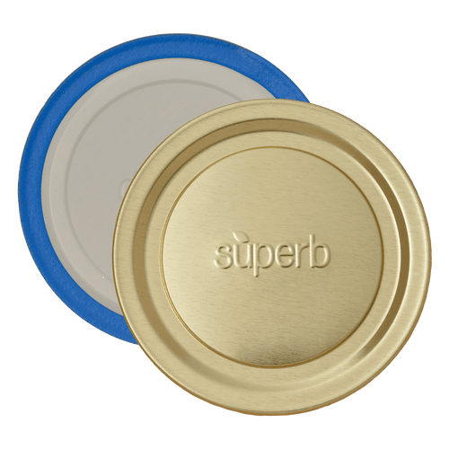 Close-up of two wide-mouth canning jar lids with one gold-colored lid embossed with "superb" and one inner sealing lid featuring a blue ring, highlighting durable design for food preservation and canning collections.