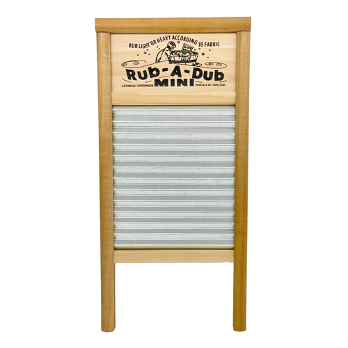 Compact washboard featuring a galvanized wavy scrubbing surface and wooden frame with decorative printed nameplate, handcrafted in the USA for Home & Decor and Laundry Supplies collections.
