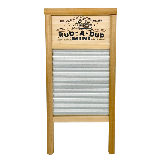 Compact washboard featuring a galvanized wavy scrubbing surface and wooden frame with decorative printed nameplate, handcrafted in the USA for Home & Decor and Laundry Supplies collections.