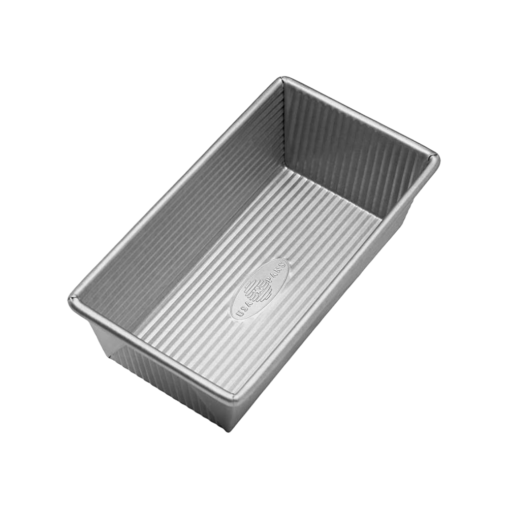 Rectangular non-stick aluminized steel loaf pan with corrugated surface for even baking, handcrafted in the USA, featured in Kitchen & Food, Cookware, Baking Supplies, and Bread Making Supplies collections.