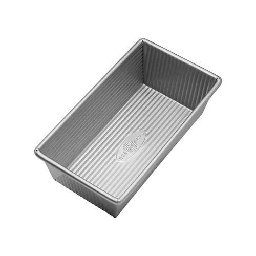 Rectangular non-stick aluminized steel loaf pan with corrugated surface for even baking, handcrafted in the USA, featured in Kitchen & Food, Cookware, Baking Supplies, and Bread Making Supplies collections.