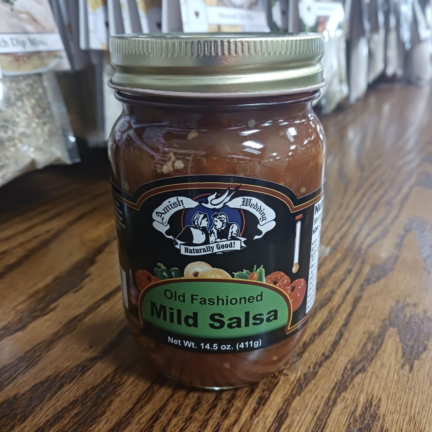 Glass jar of handcrafted Amish Wedding Mild Salsa with thick, chunky texture, made in USA, ideal for Kitchen & Food, Snacks and Sweets, Pantry, USA Made, Best Sellers, and Promo Eligible collections.