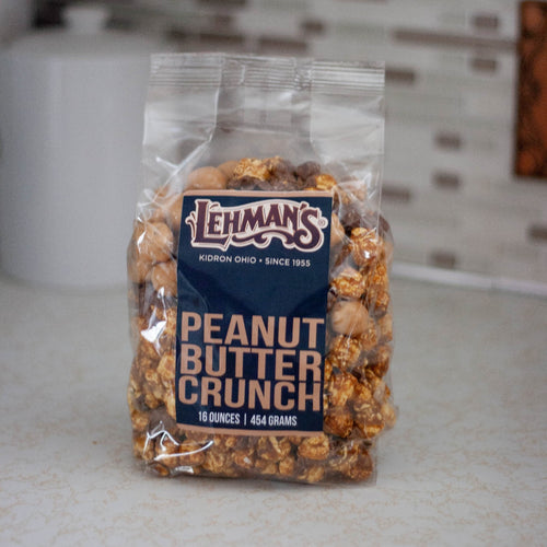 Clear bag of handcrafted peanut butter crunch popcorn, a unique sweet and crunchy snack made in USA, perfect for Kitchen & Food, Snacks and Sweets, Popcorn, USA Made, and Best Sellers collections.