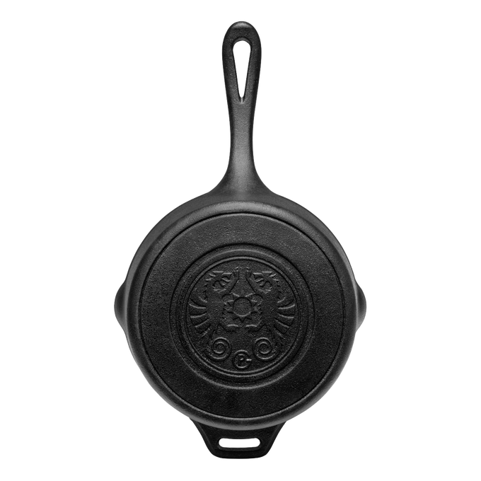 Top view of a handcrafted cast iron saucepan with embossed lid pattern and extended handle, crafted for farm, garden, camping, kitchen, cookware, and cast iron collections.