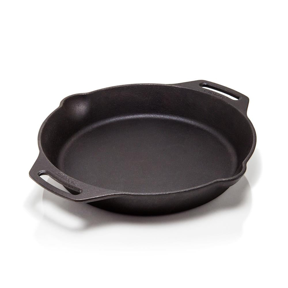 Round cast iron fire skillet with two wide side handles and a pouring spout, handcrafted for versatile outdoor and kitchen cooking in farm, camping, and cookware collections.