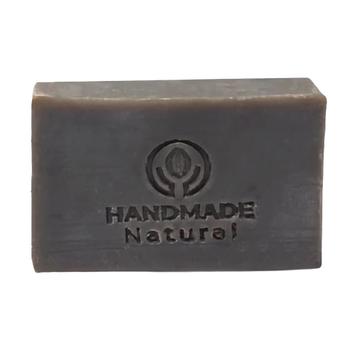 Rectangular dark brown bar of soap embossed with a handmade natural logo, representing an organic, handcrafted Ayurvedic soap ideal for health and wellness collections.