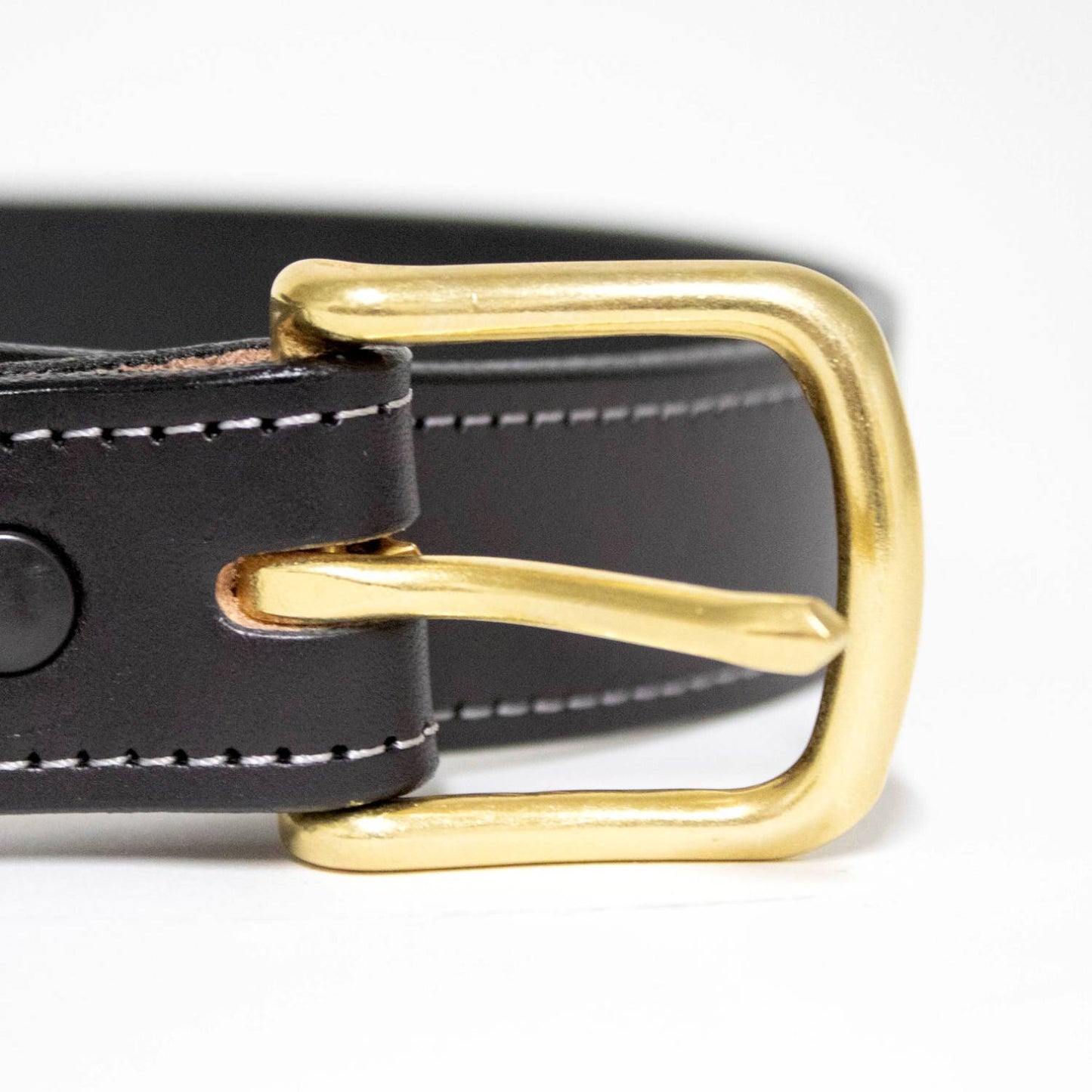 Handcrafted Amish-made black genuine English bridle leather belt with fine white stitching and a polished solid brass buckle, part of Clothing and Accessories, USA Made, and Best Sellers collections.