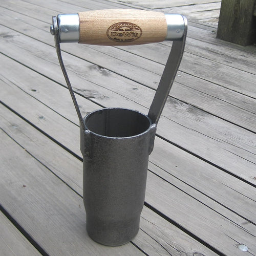 Handcrafted British style bulb planter with a sharp cutting edge and sustainably made ash wood handle, designed for easy soil extraction in farm and garden use.