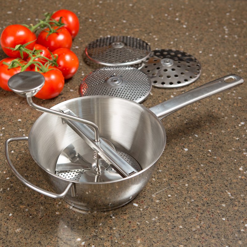 Handcrafted 2-quart stainless steel food mill with a crank handle and four interchangeable discs, perfect for food prep in kitchen, farm, and homesteading collections.