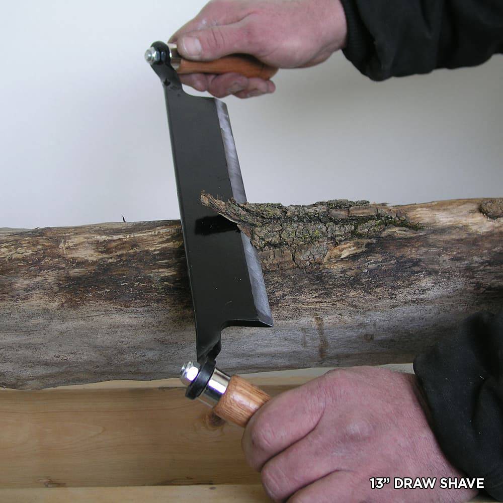 Handcrafted draw shave with solid steel blade and wooden handles removing bark from a log, ideal for Farm, Garden & Tool, Garden Accessories, Wood Cutting and Hauling, and Best Sellers collections.