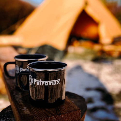 Black enamel camping mugs with branded logo, made of durable enameled steel, shown outdoors near a tent, ideal for Farm, Garden & Tool, Kitchen & Food, Camping, and Brewing Coffee collections.