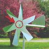 Handcrafted metal ball bearing mounted at the center of a shiny windmill blade assembly in an outdoor garden setting, part of Farm, Garden & Tool and Pest Control collections.