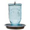 Antique-style blue glass Mason jar with embossed bird and leaf design, featuring a galvanized metal base and circular perch, handcrafted for farm, garden, and animal care use.