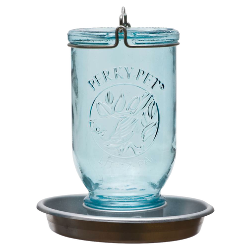Antique-style blue glass Mason jar with embossed bird and leaf design, featuring a galvanized metal base and circular perch, handcrafted for farm, garden, and animal care use.