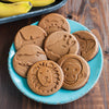Round light brown pancakes on a blue plate featuring fun animal shapes including monkey, lion, giraffe, elephant, rhino, and alligator, handmade in USA, ideal for Kitchen & Food and Cookware collections.
