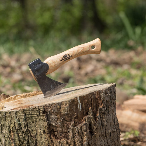 Compact handcrafted hand hatchet with tempered steel blade and smooth wooden handle embedded in a tree stump, ideal for Farm, Garden & Tool and Wood Cutting collections.