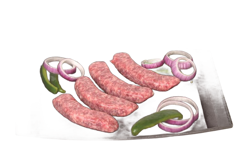 Cast iron baking and serving platter holding uncooked sausages with sliced red onions and green peppers, part of Kitchen & Food, Cookware, Cast Iron, USA Made, and Best Sellers collections.