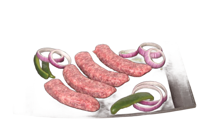Cast iron baking and serving platter holding uncooked sausages with sliced red onions and green peppers, part of Kitchen & Food, Cookware, Cast Iron, USA Made, and Best Sellers collections.