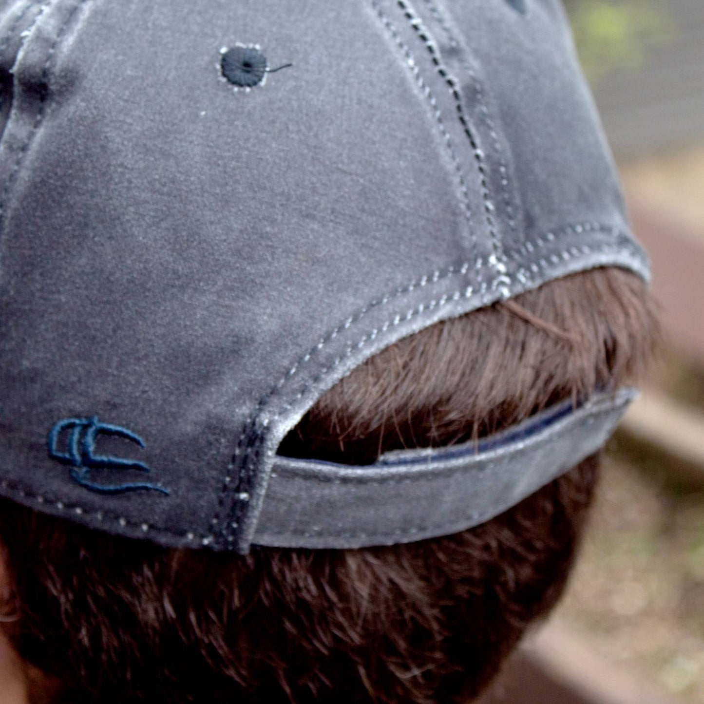 Close-up of a washed cotton adjustable cap with vintage style and hook and loop closure in muted gray, featuring handcrafted Amish made quality, ideal for Health & Wellness, Clothing and Accessories, Best Sellers, and Promo Eligible collections.
