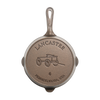 Bottom view of a handcrafted, lightweight cast iron skillet embossed with a horse-drawn wagon and marked size 6, made in the USA for Kitchen & Food, Camping, and Cast Iron collections.