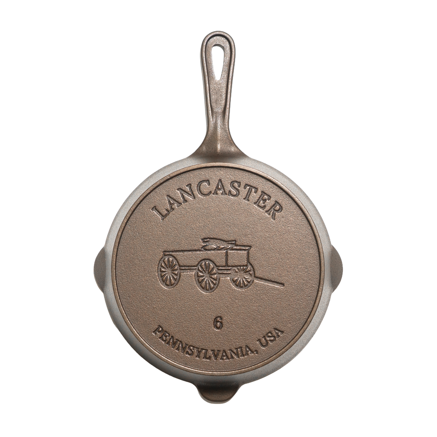 Bottom view of a handcrafted, lightweight cast iron skillet embossed with a horse-drawn wagon and marked size 6, made in the USA for Kitchen & Food, Camping, and Cast Iron collections.